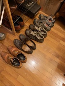 Shoes lines up on floor in a row