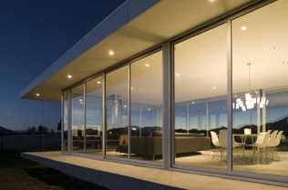 Glass house with windows from outside looking in